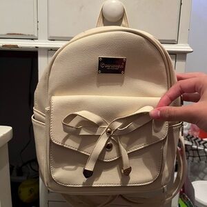 cream colored mini bag